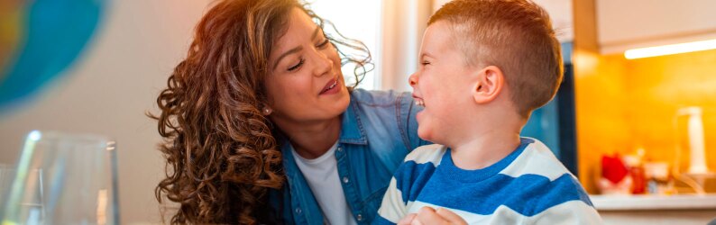 Kind female teacher helping her student doing homework.