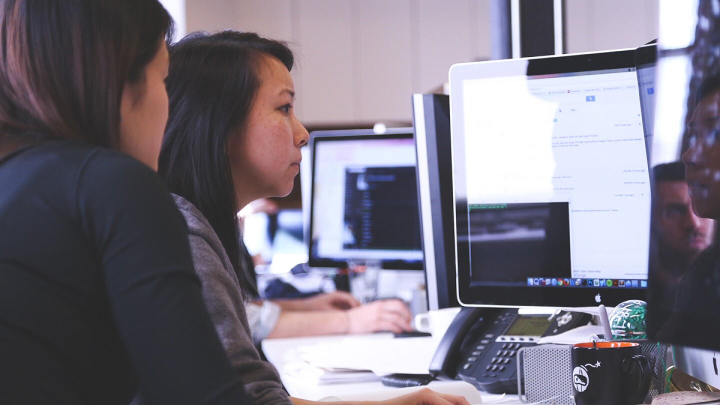 Two students working at a startup