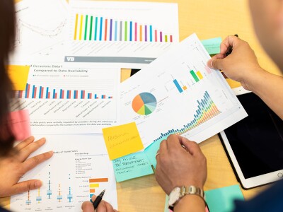 Two professionals analyzing company documents