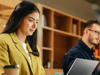 Young female professional working full-time while earning her MBA online.