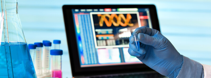scientist holding biomedical equipment