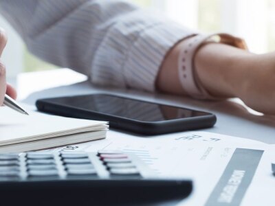 Female accountant using computer to generate financial reports.