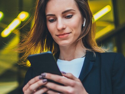 Female lawyer outside using her smart phone