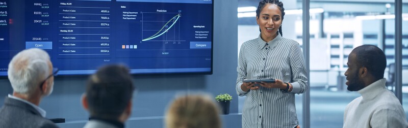 Corporate finance leader presenting data and strategy