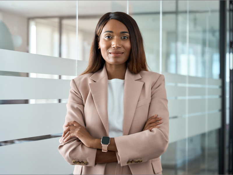 Confident African American female posed facing the camera in business attire