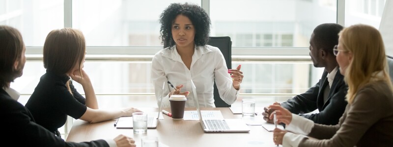 Female executive leads a business meeting