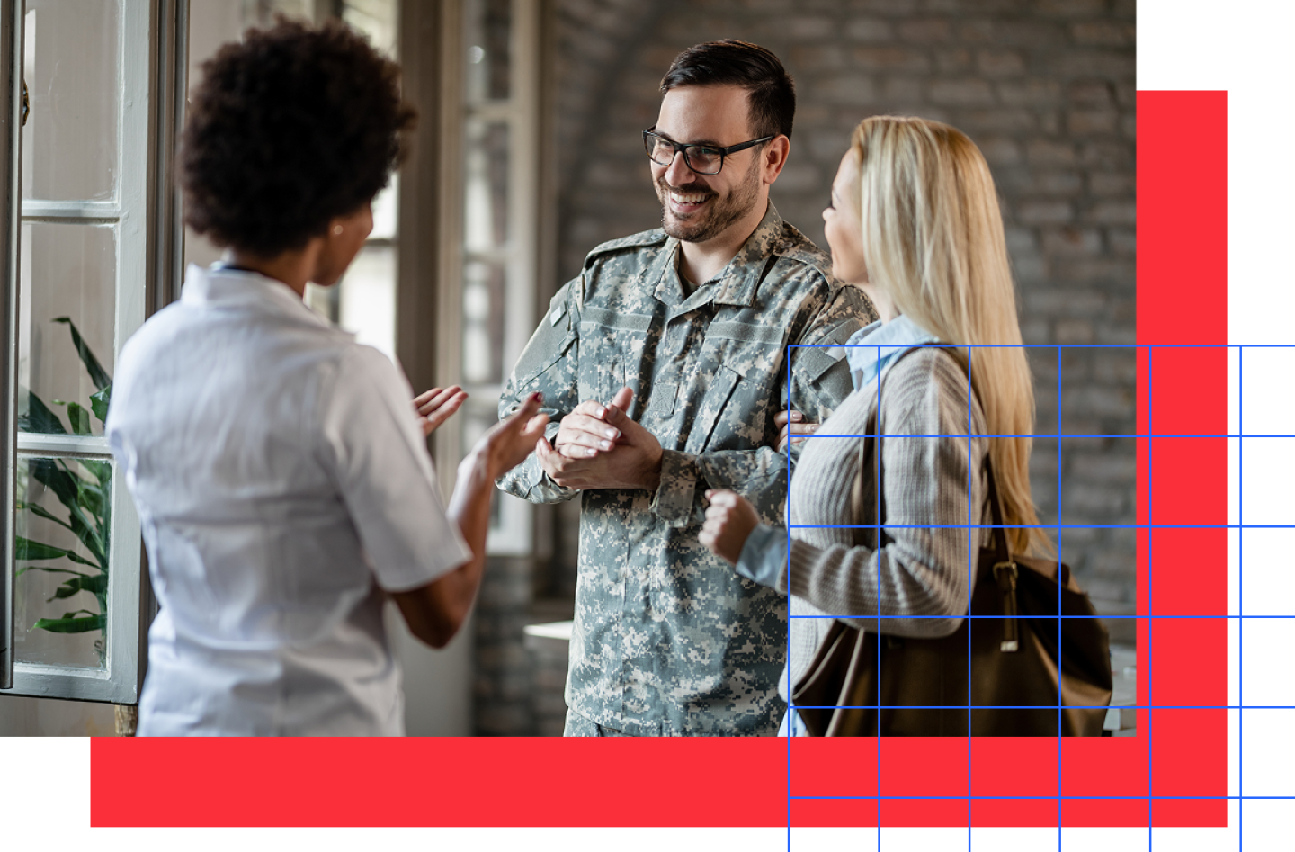 Uniformed male army soldier speaking with two women