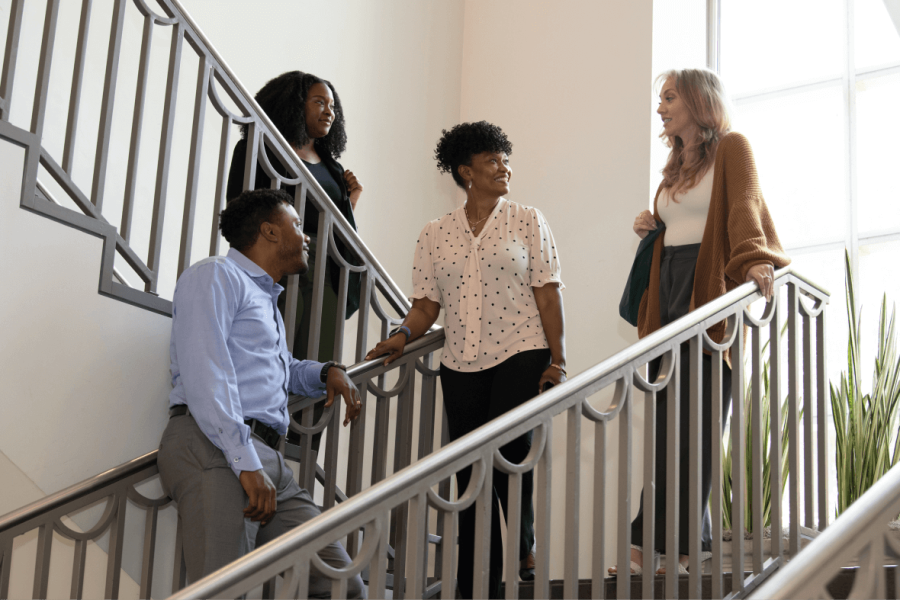 Group of Tulane students on staircase talking to each other