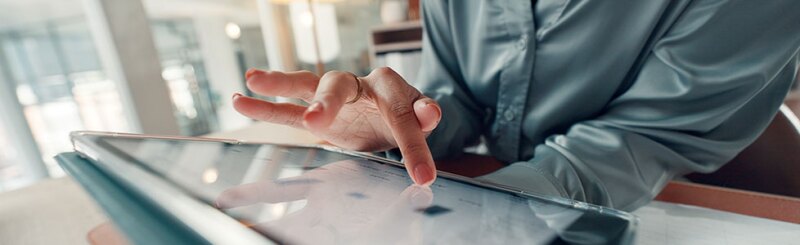Educator reviewing data on a tablet