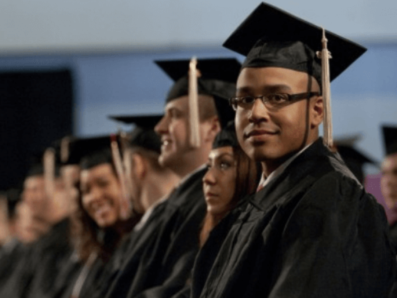 Line of graduates in caps and gowns