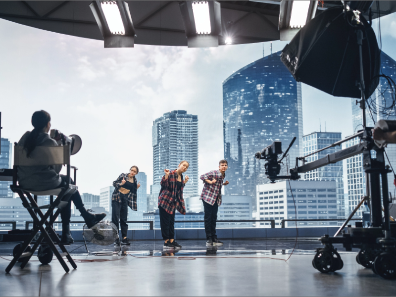 3 professional entertainers that are recording a video dance scene