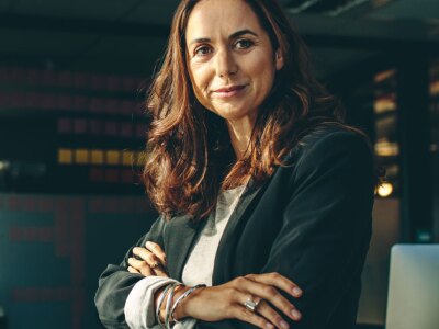 Mature businesswoman sitting on her desk