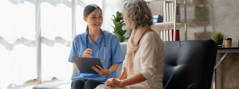 Nurse discussing care with a patient.