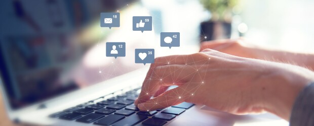 Hands-Typing-Over-Keyboard-With-Social-Icons