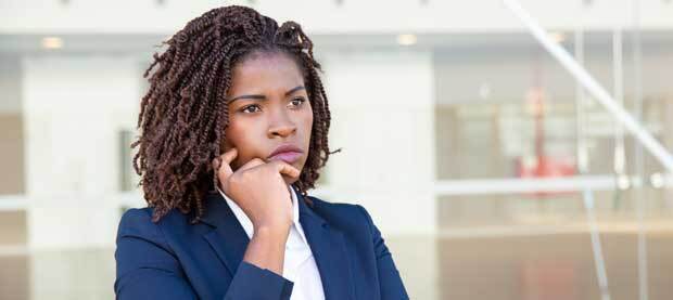 woman in business suit looking concerned