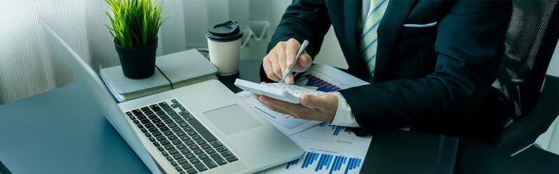 An accountant using a calculator