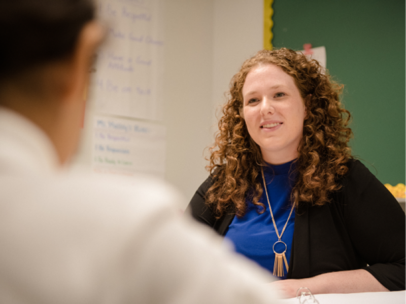 Man speaking with a teacher during an internship