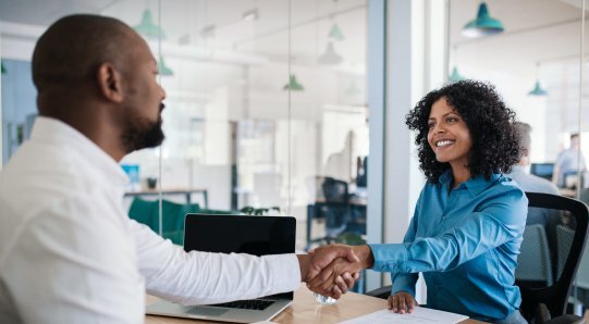 A man and a woman shaking hands