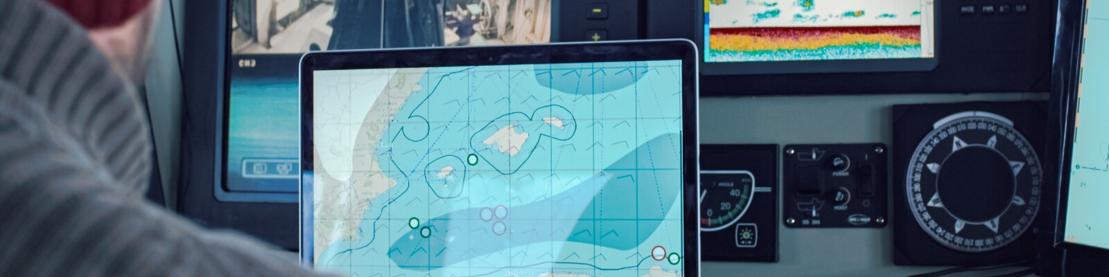 Maritime map on a laptop with other thermal mapping graphics in background