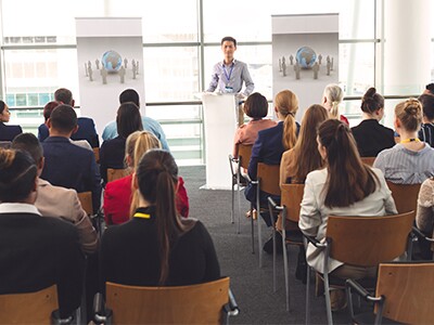 Room-Of-Attendees-Listening-To-Presenter-At-Professional-Counseling-Conference