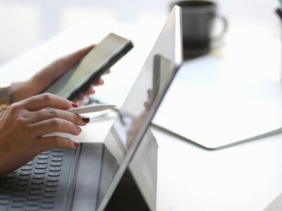 Side view of female nurse researching education options for her career.