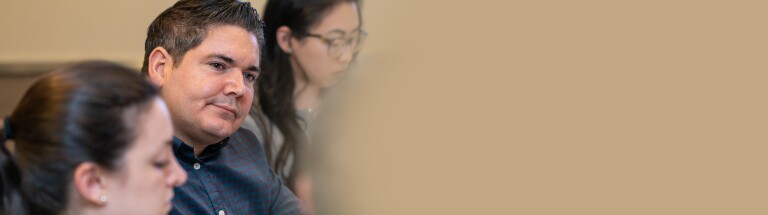 man paying attention to speaker