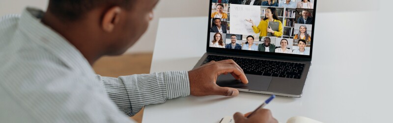 Online learning. Man at home watching an online webinar