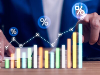 man pointing to chart going up in price