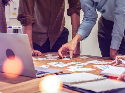 Group of young businesspeople discussing roadmap to business launch.