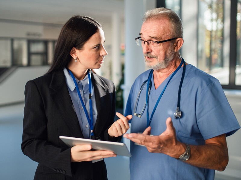 Doctor speaking with administrator