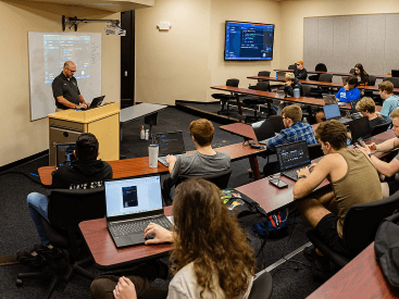 Lecture hall of students listening to instructor speak