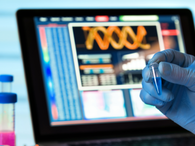 scientist holding biomedical equipment