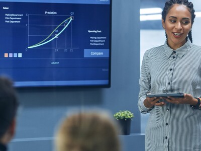 Corporate finance leader presenting data and strategy