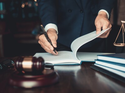 Justice and law concept. Gavel on sounding block in hand's Male