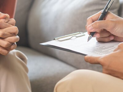 Male counselor during a session with mental health patient.