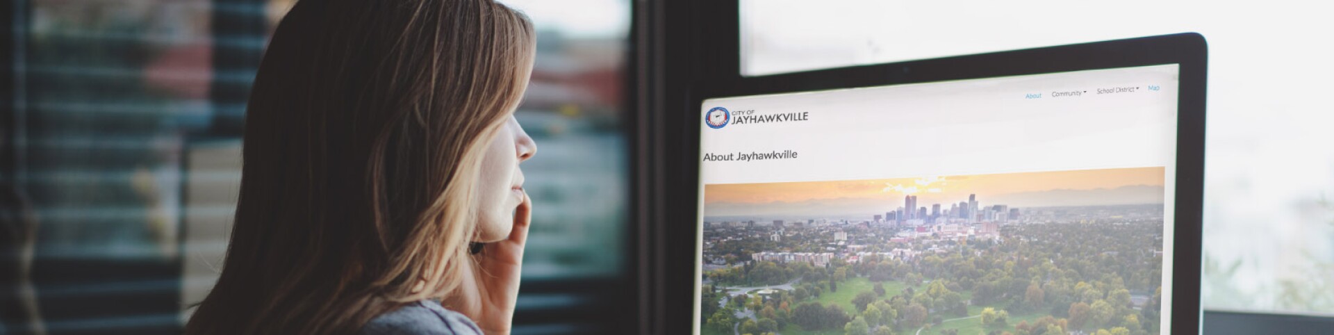 Woman On Computer Using Jayhawkville