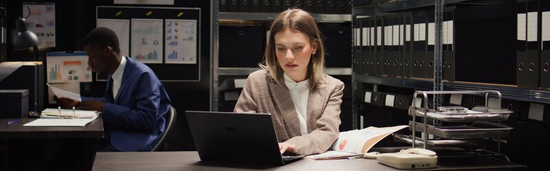 A woman working on a laptop.