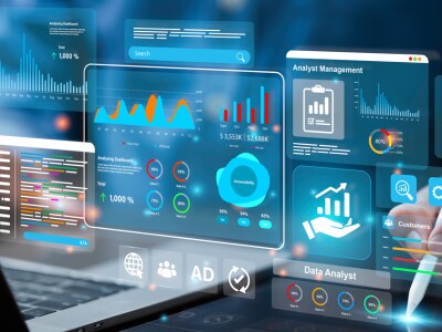 man on laptop with analytics