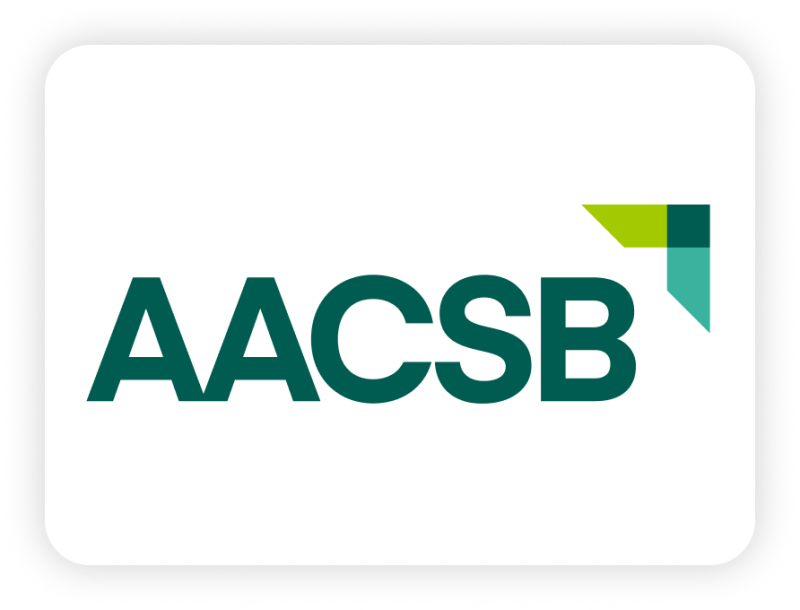 AACSB logo with teal lettering and a green and teal geometric corner mark on a white background.