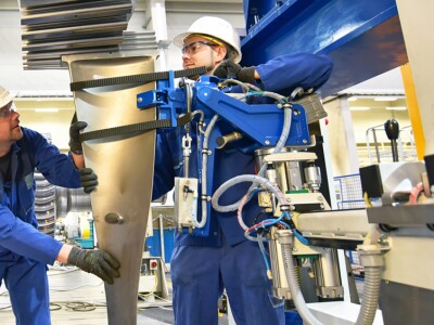 menn working on giant machine