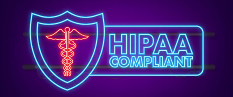 Light up sign reading, "HIPAA Compliant."
