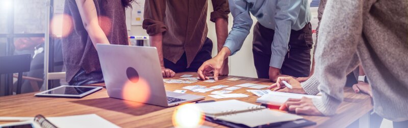 Group of young businesspeople discussing roadmap to business launch.