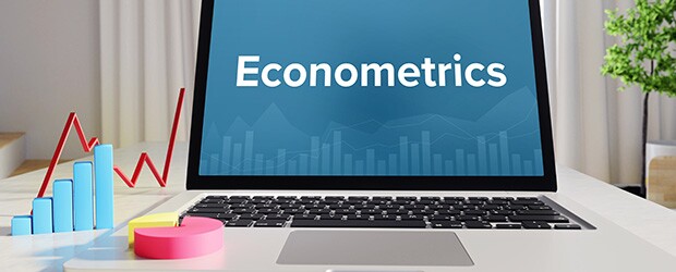 Laptop on desk with Econometrics