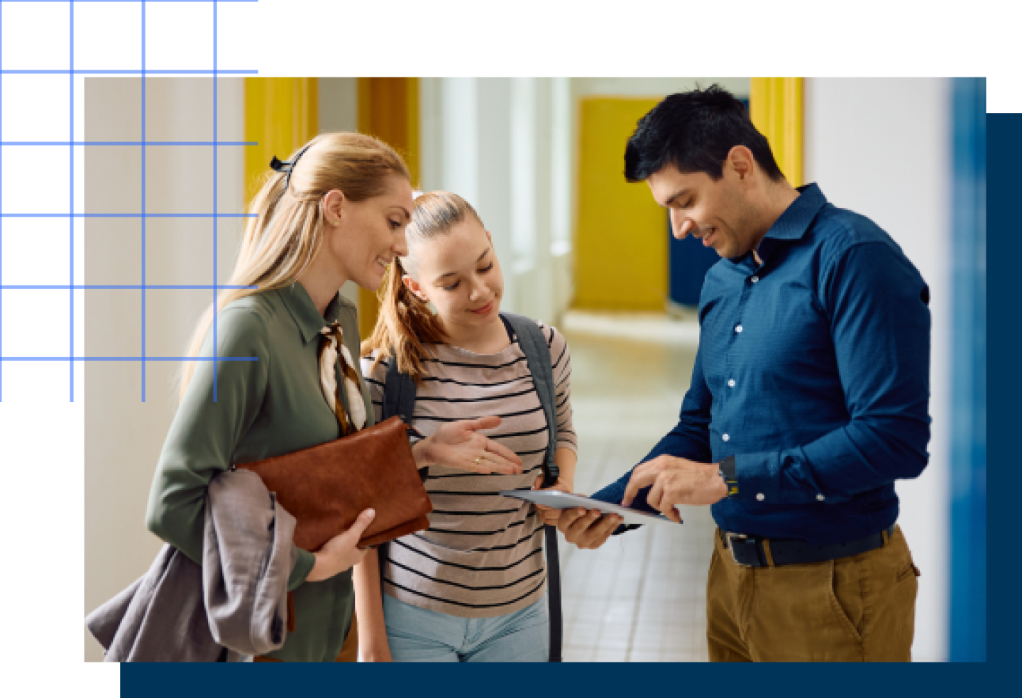 A male principal assists a female student and her mother.
