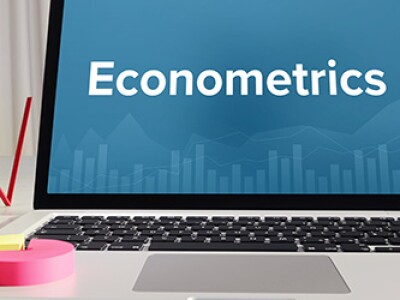 Laptop on desk with Econometrics