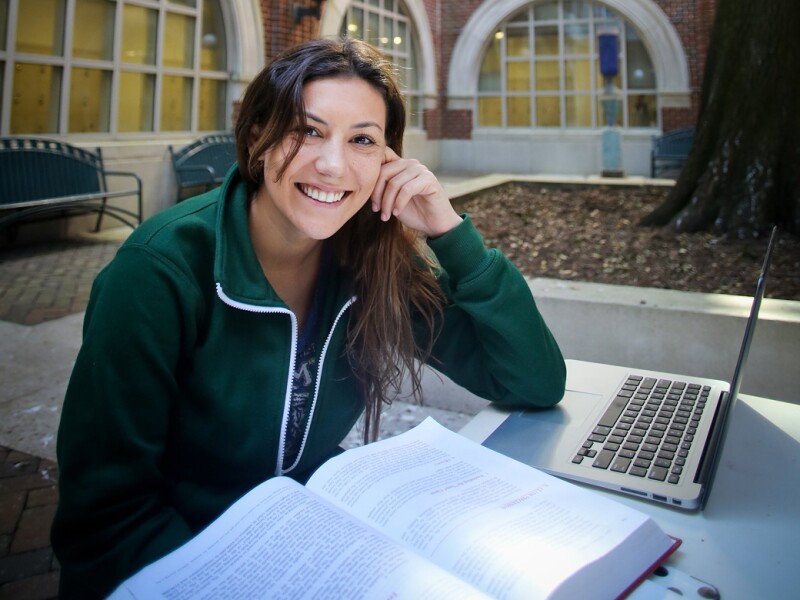Female student studying at laptop