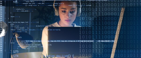 Woman wearing headphones working on laptop with data sets as overlay in foreground