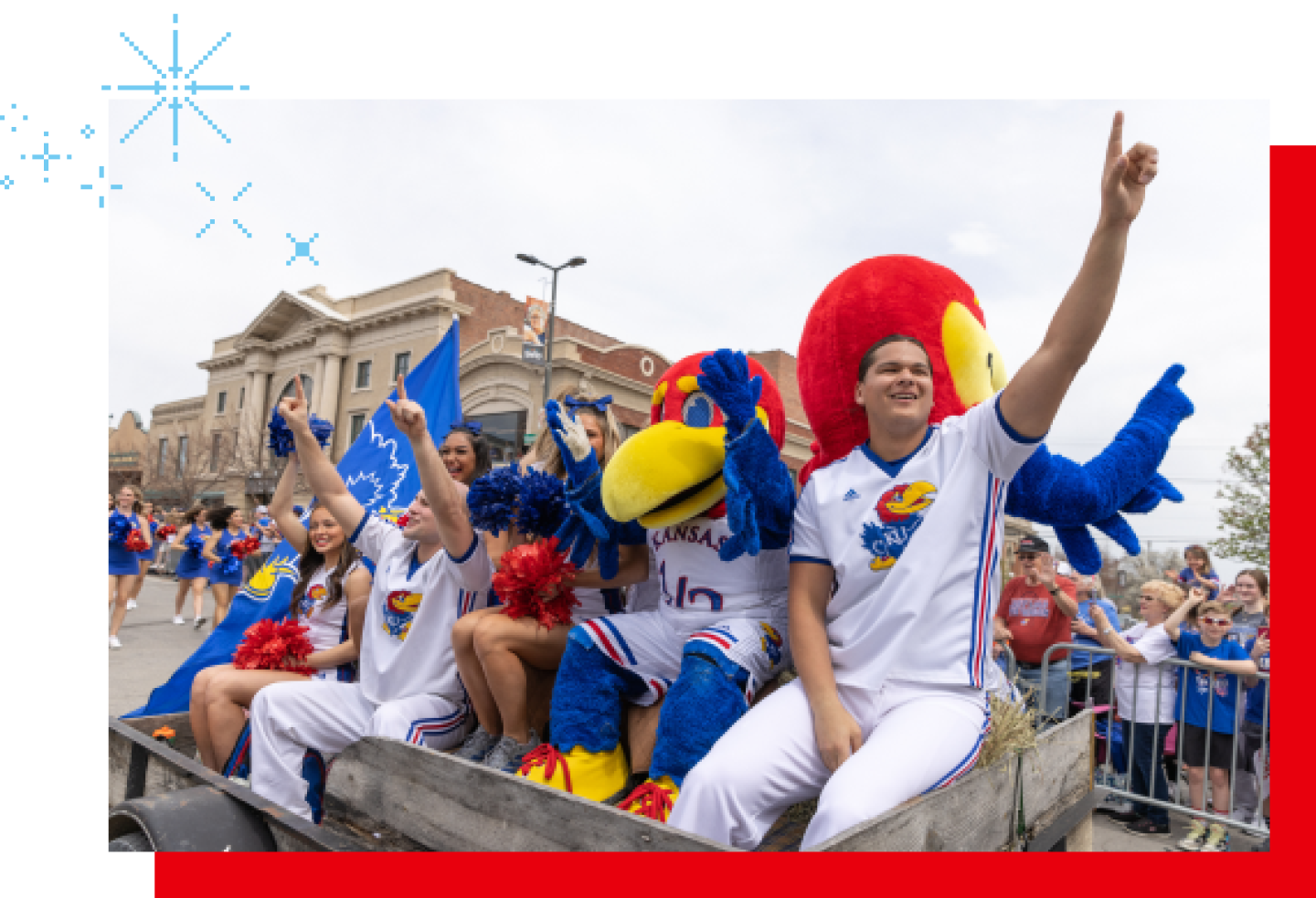 Members of the women's softball team cheer in a parade after a title game.