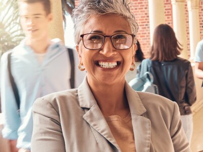 principal smiling in front of students