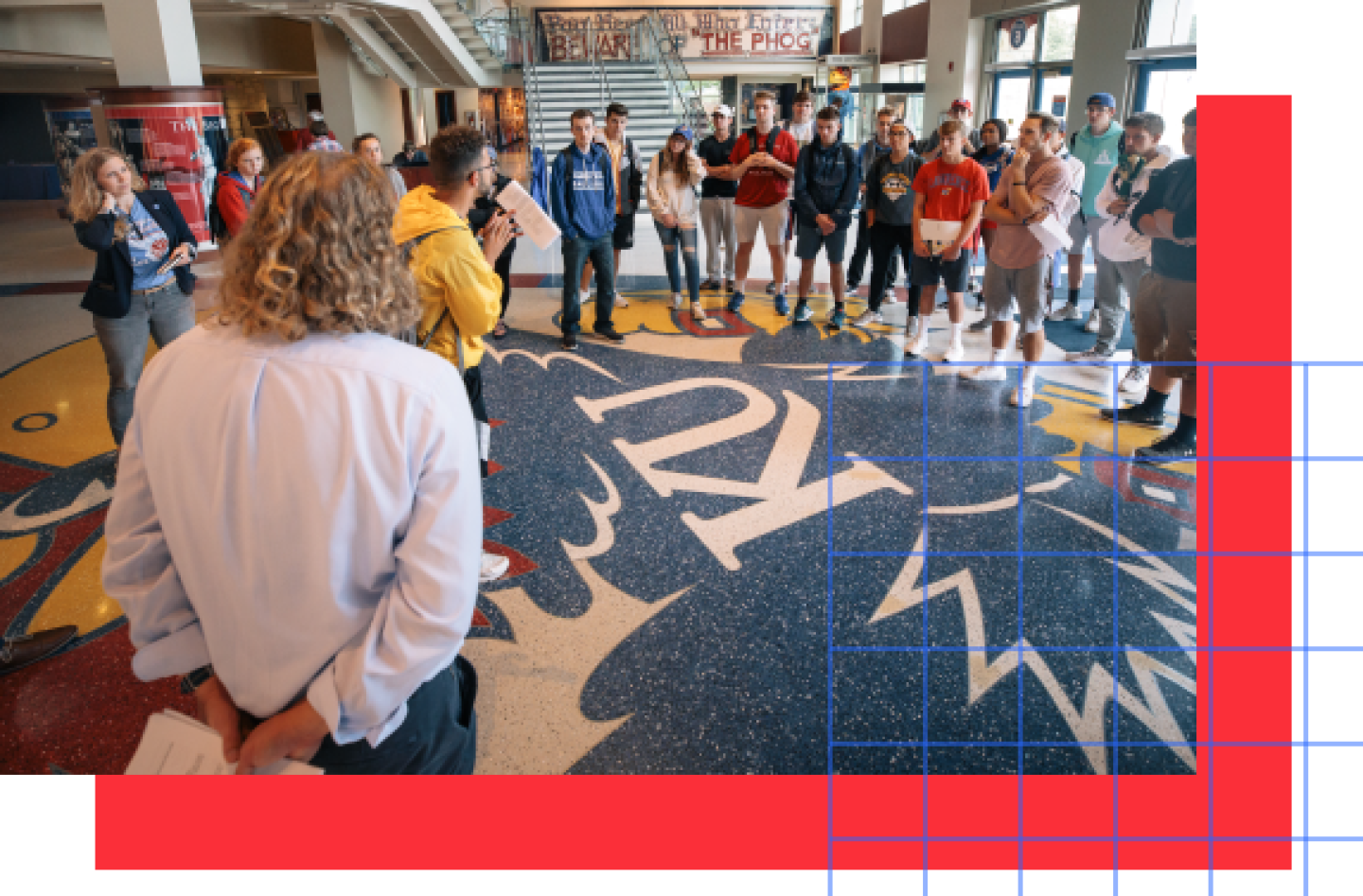 A group of KU students gathers in the campus lobby.